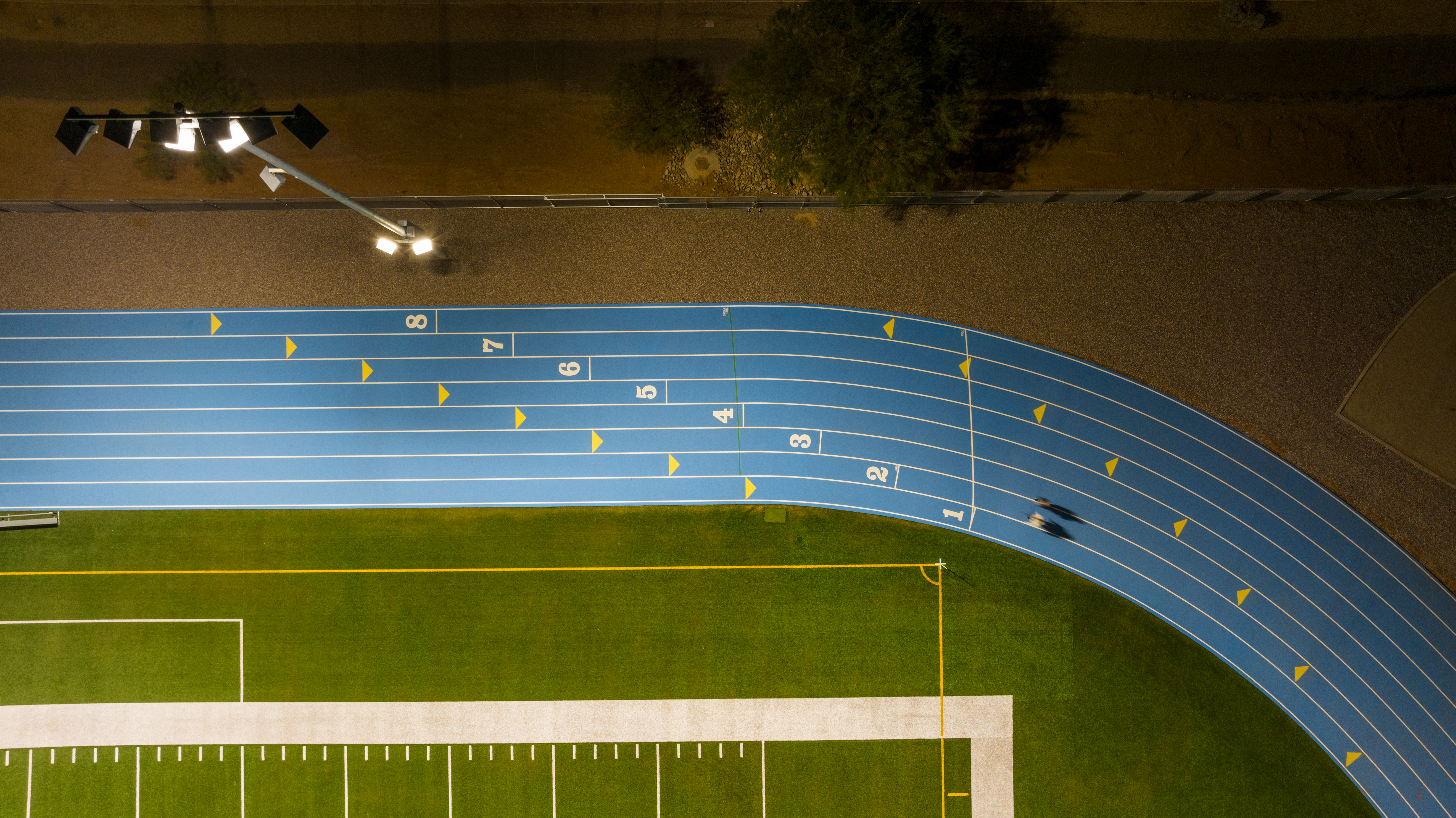 Overhead view of a track at night.