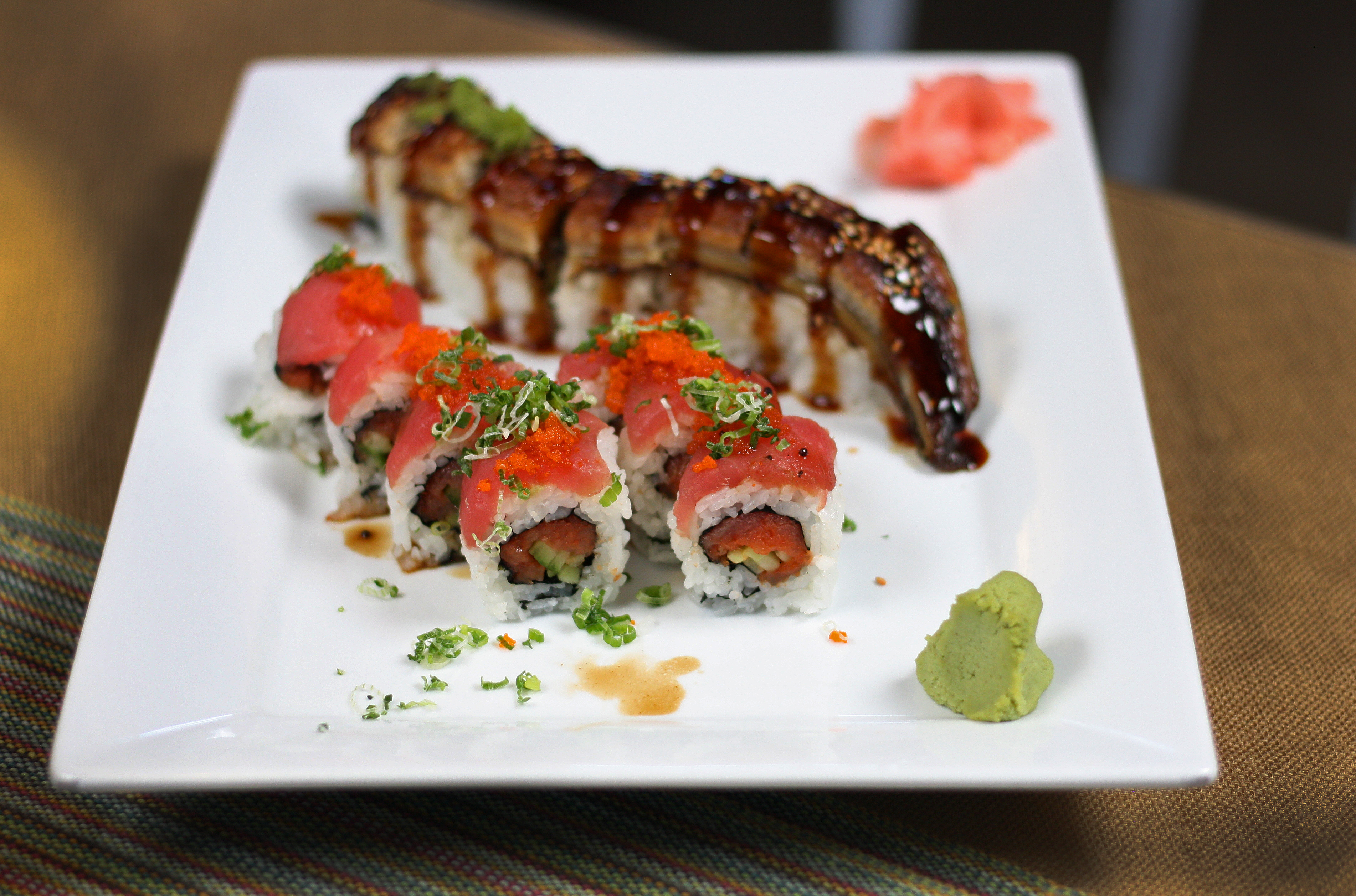 Sushi placed professionally on a plate.